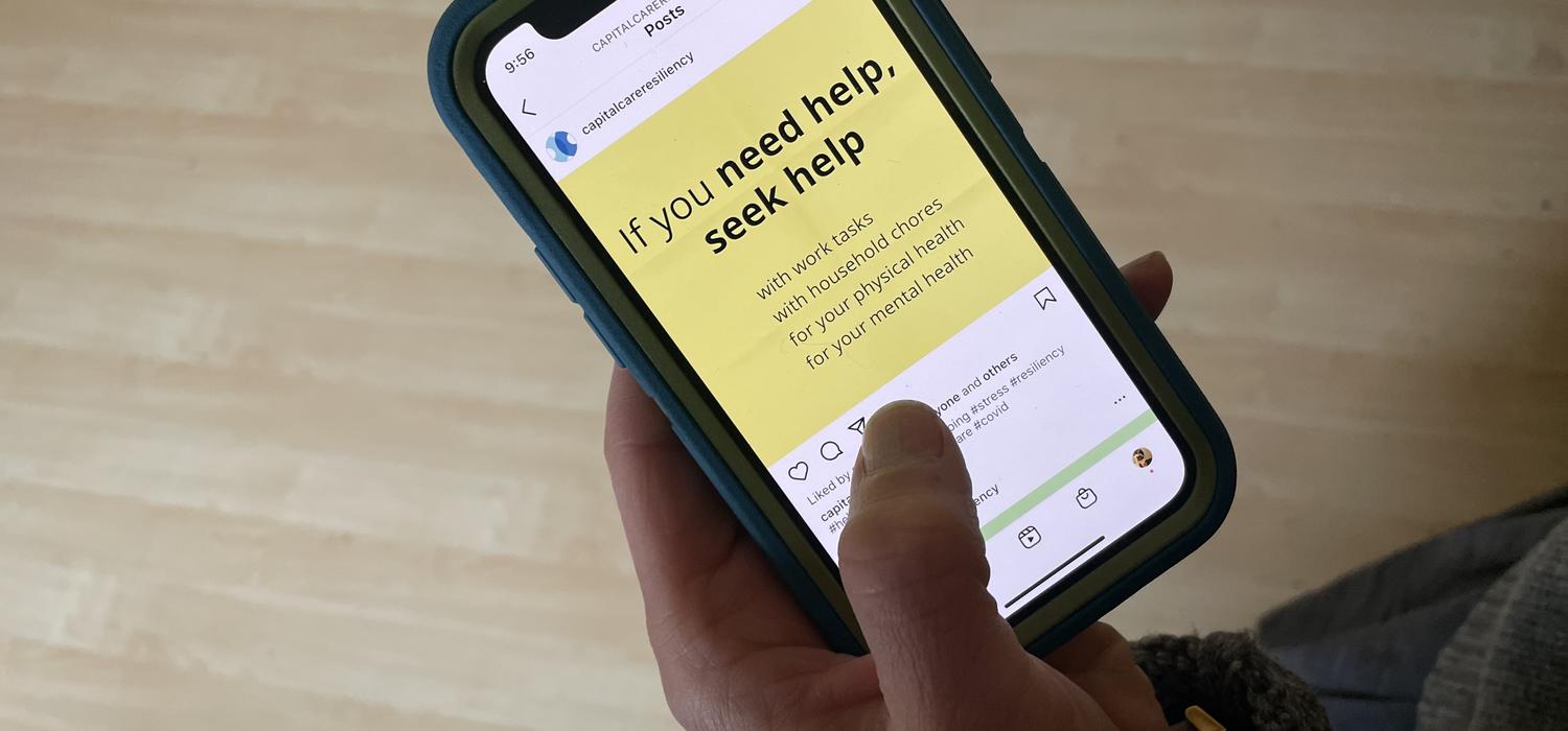Phone displaying Capital Care Resiliency Instagram Post