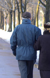 Seniors walking in springtime snow