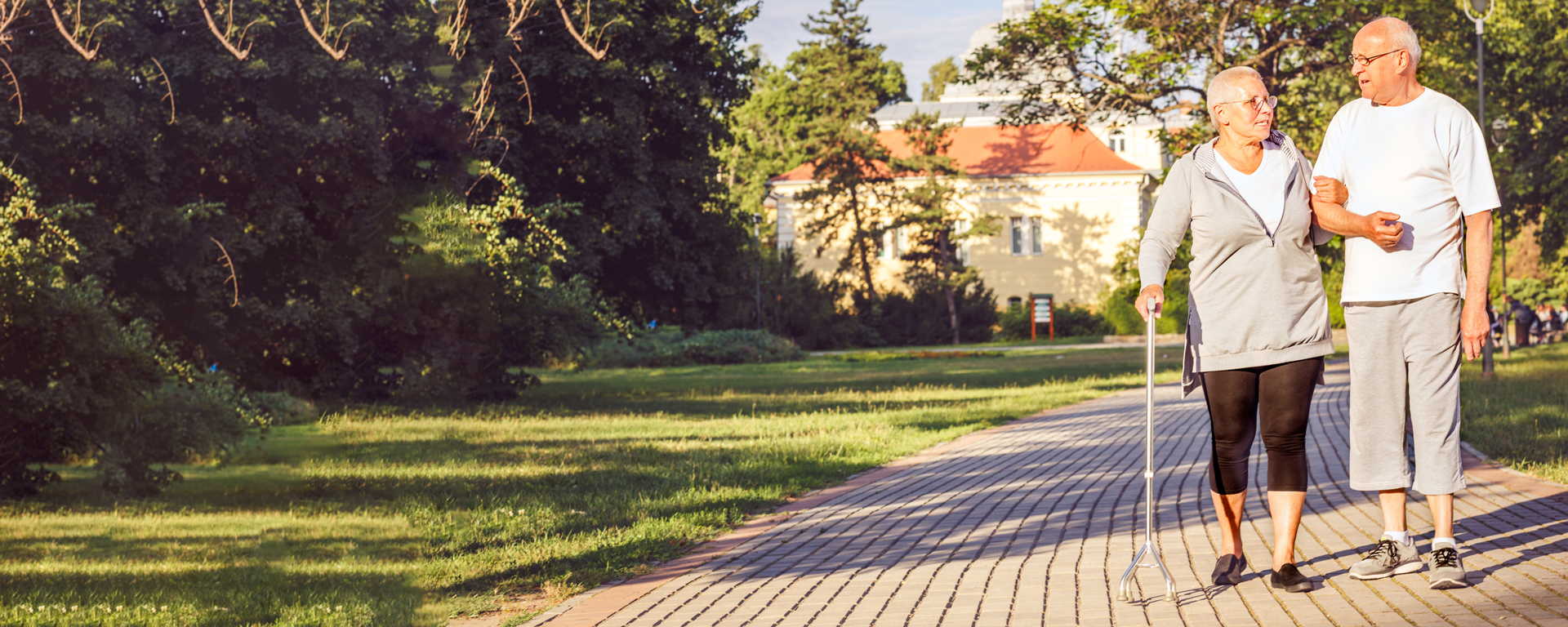 Happy Family - Elderly couple walking through the park.
