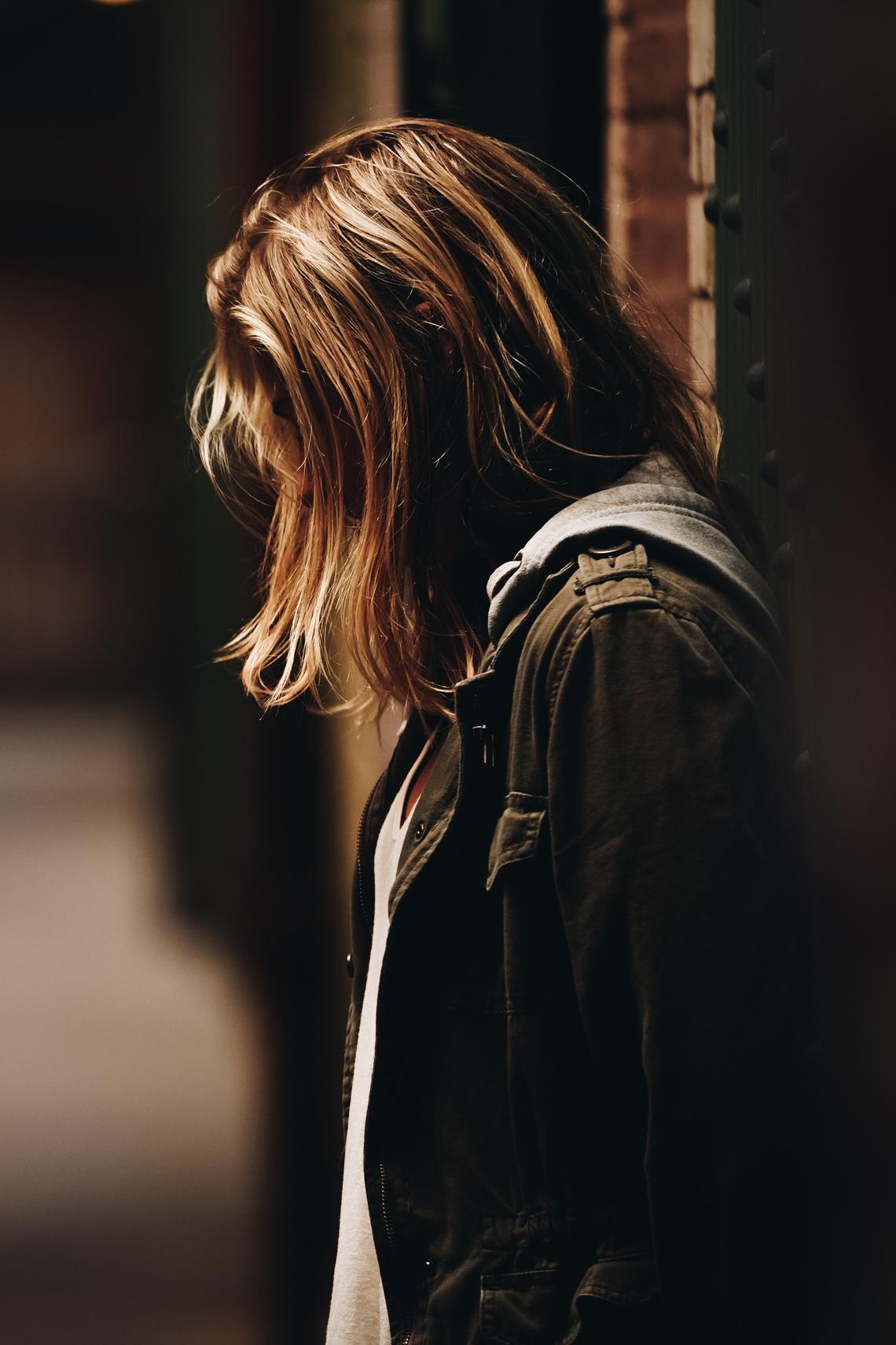 image of youth standing in darkness 