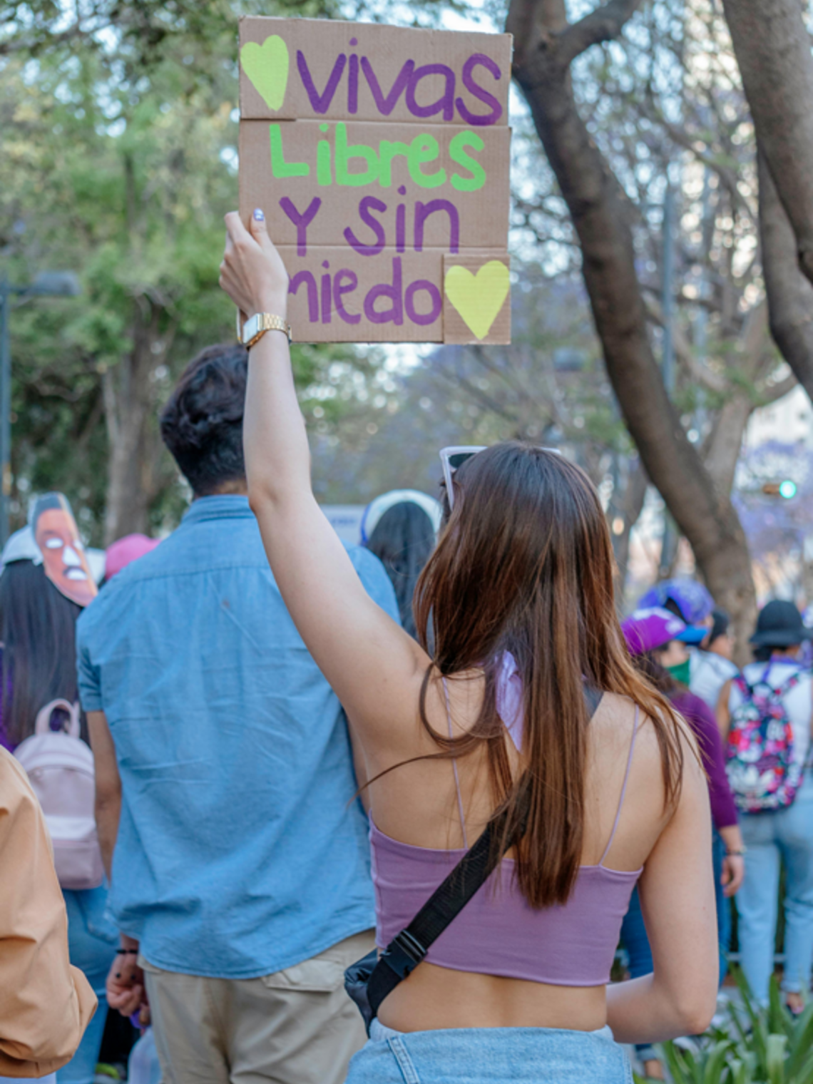 Young Woman with Banner Live Free and Without Fear