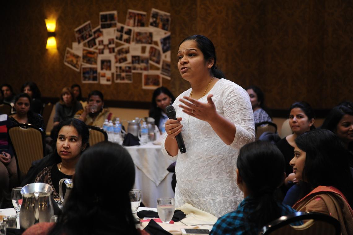 A woman speaking at a community meeting