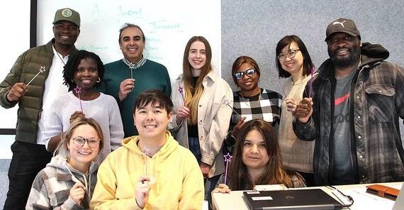 Lateef Habib and students pose with their magic wands