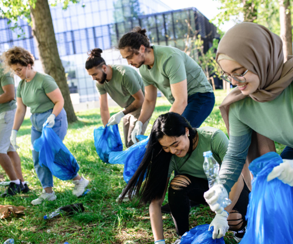 young people picking up litter in a community project setting