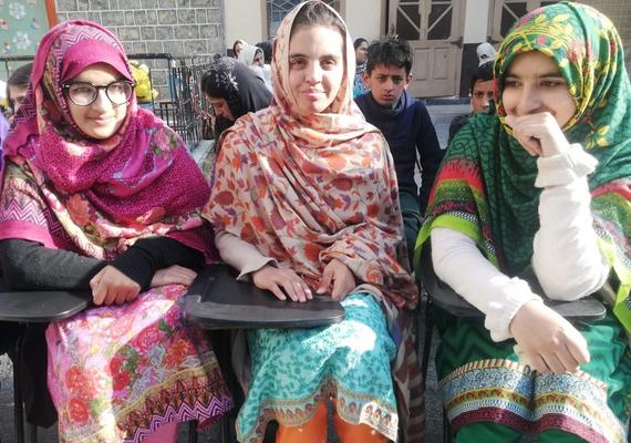 Parents and children in Northern Pakistan in colourful dresses
