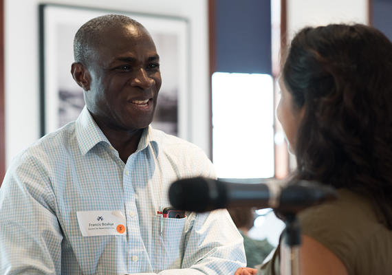Alumnus Francis Boakye, PhD. Vice President, Strategy Calgary Centre for Newcomers in conversation at a community forum
