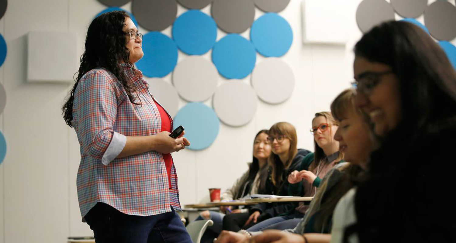 University of Calgary Faculty of Social Work professor addresses students at an orientation meeting